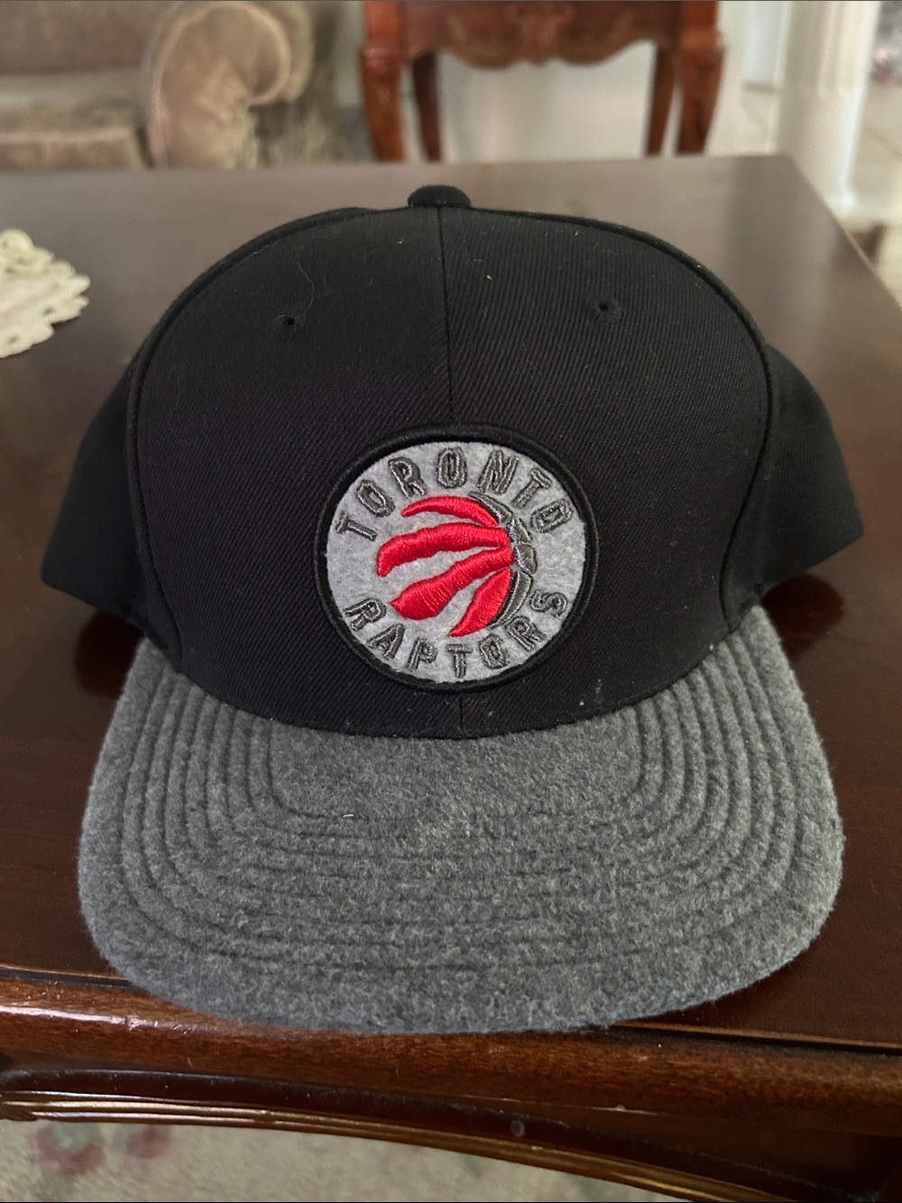 Mitchell & Ness Black Crown Hat with Gray Brim and Red Raptors Patch
